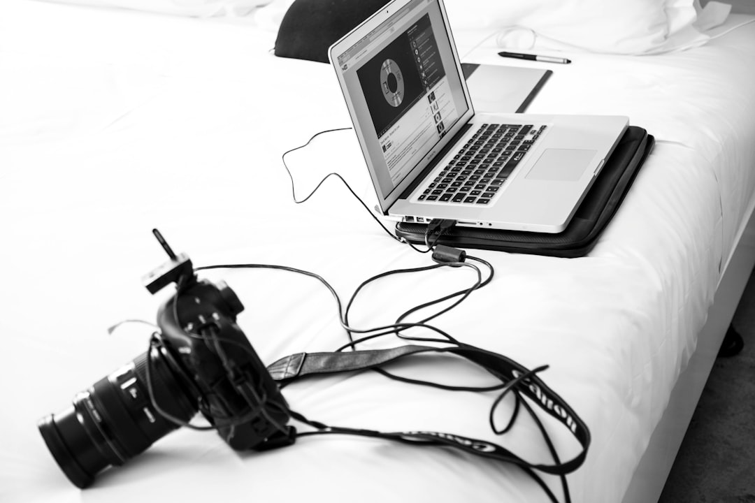 grayscale photography of dslr camera and macbook pro video project clip selection editing tips