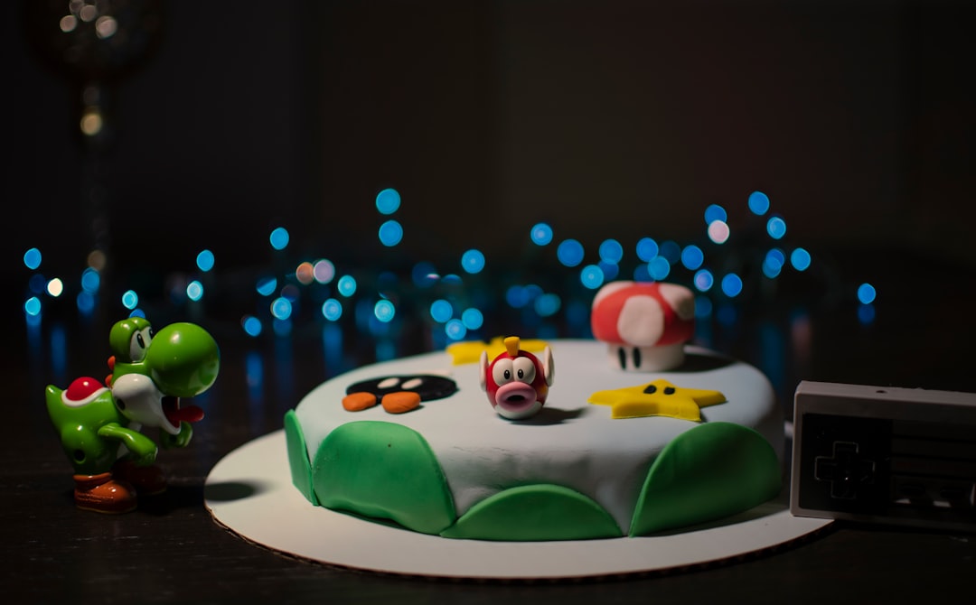 green frog on green frog figurine bonus check video game studio game team celebration