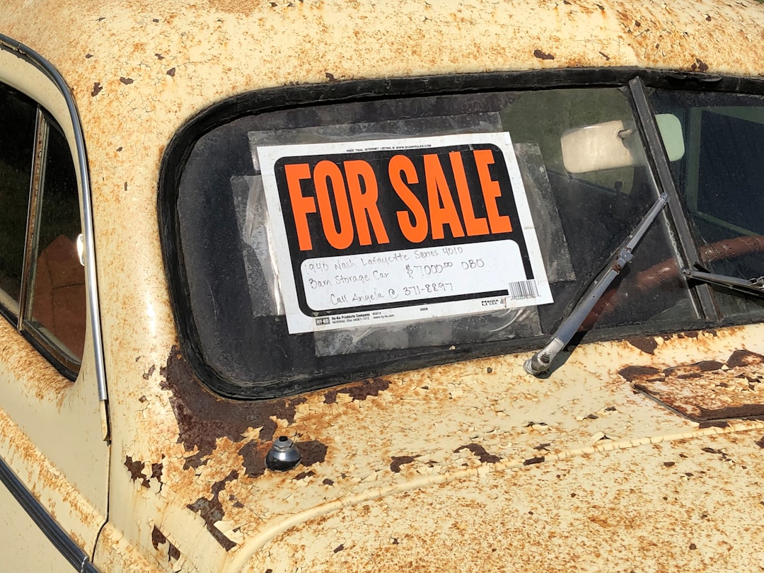 a rusted out car with a for sale sign on it online auction dutch bidding internet marketplace