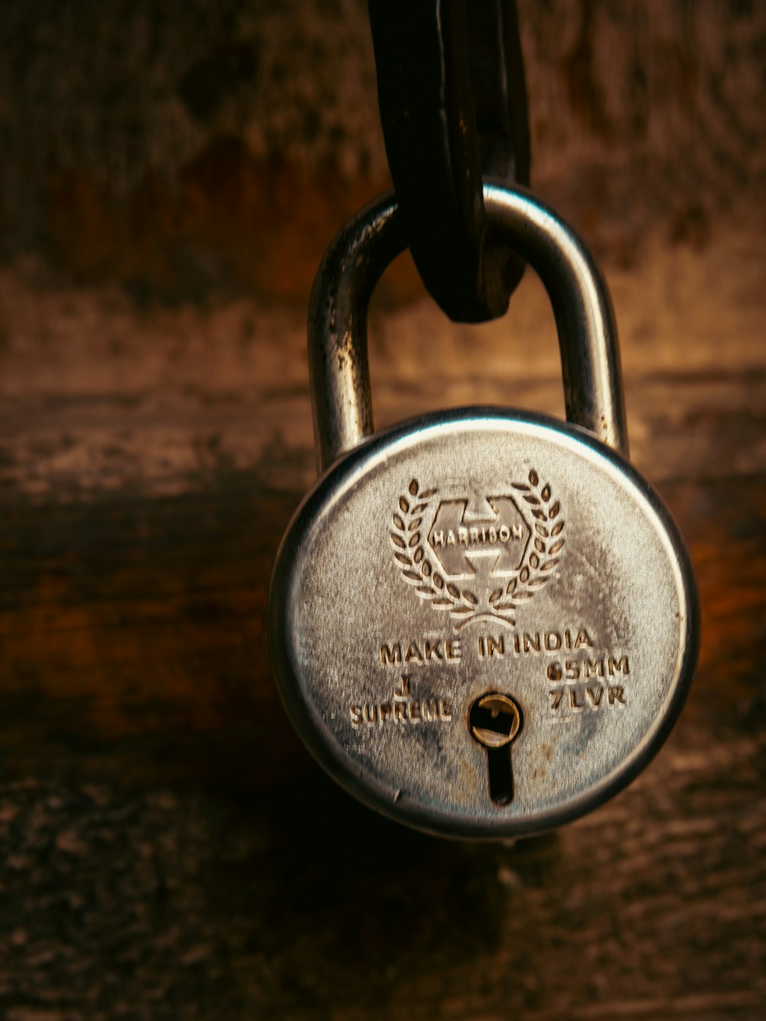 a vintage padlock hangs on a wooden surface website browser lock certificate safety