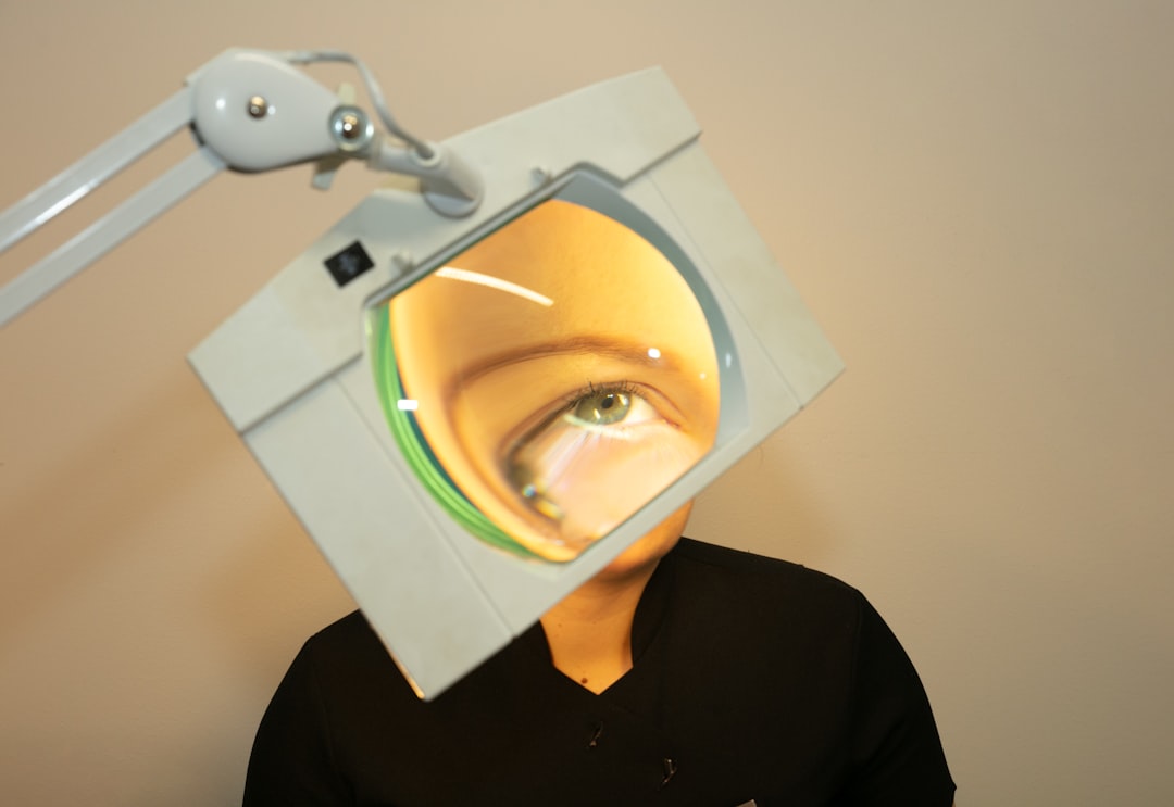 person in black shirt wearing white mask face recognition tools computer code