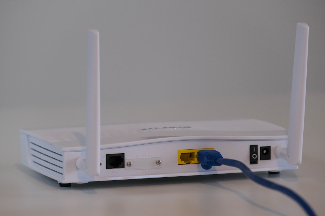 white router on white table router modem internet speed