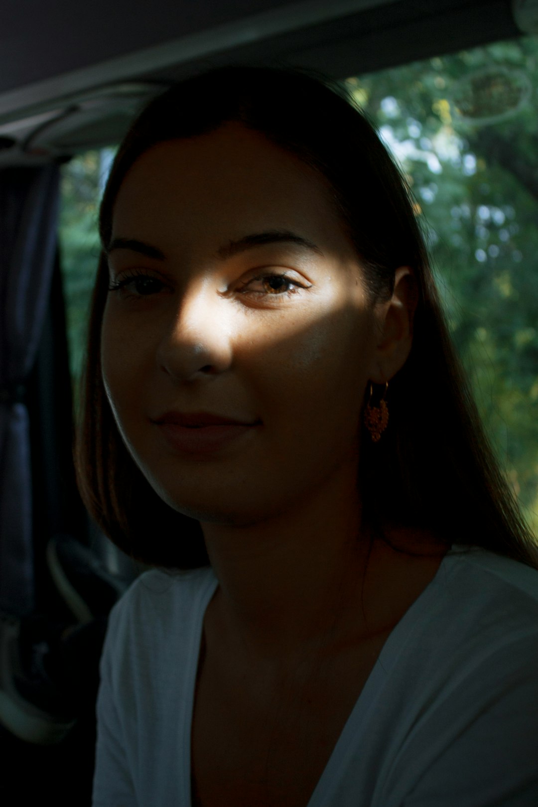 woman in white top happy person glowing sun transformation