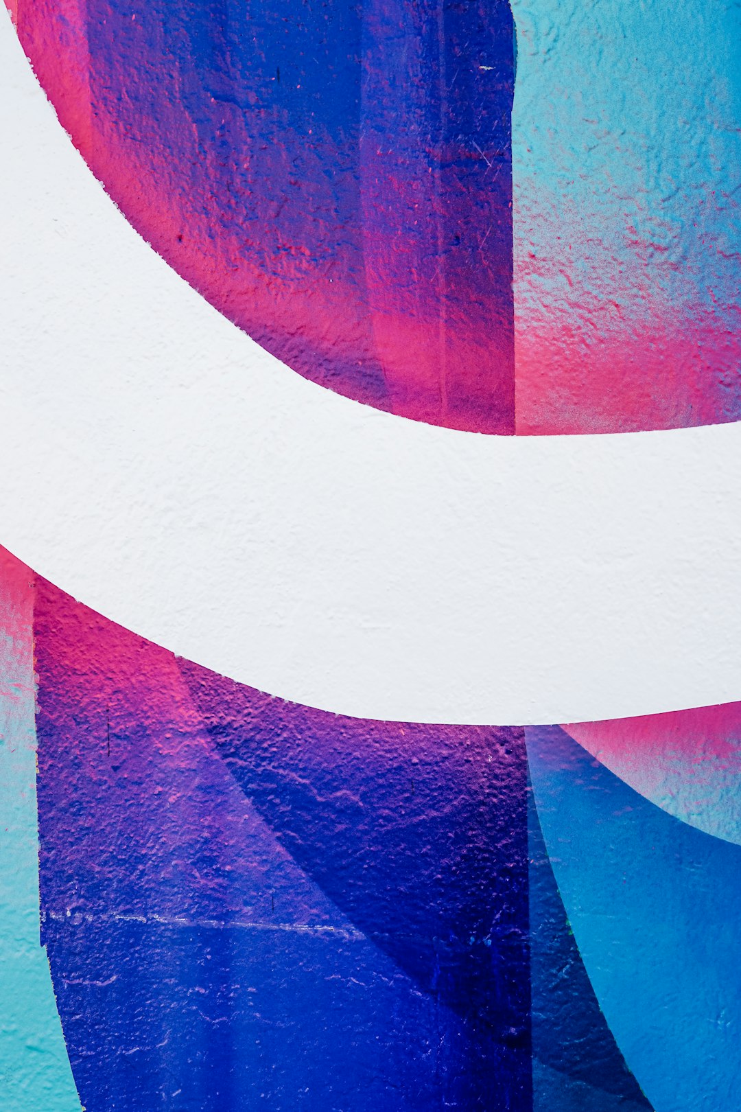 a blue and pink abstract painting on a wall poster design mockup bold typography abstract colorful background creative layout