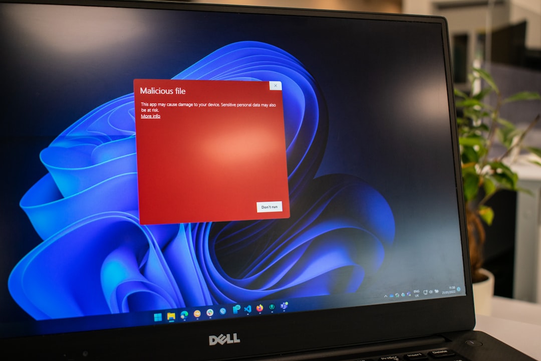 a dell laptop computer with a red screen windows security scan screen antivirus software interface malware detection progress