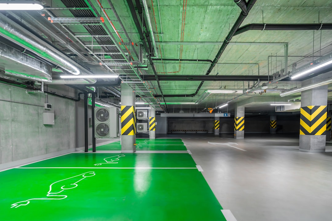 a parking garage with green and yellow lines on the floor green energy server room renewable concept eco hosting