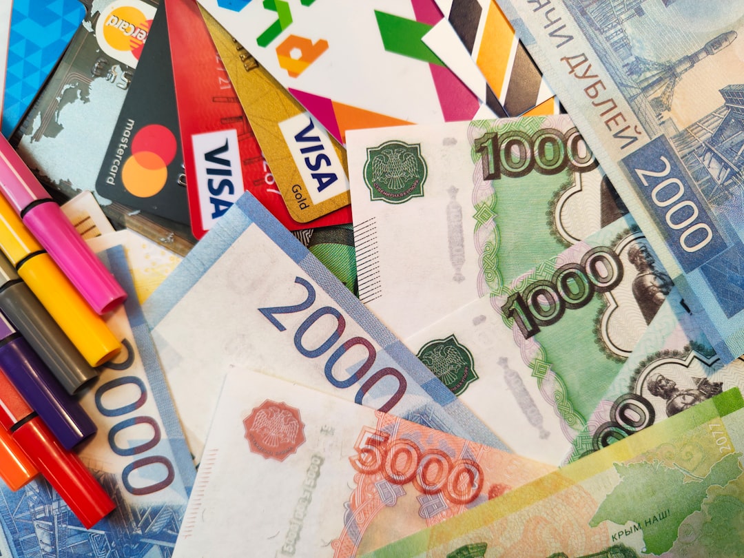 a pile of money with markers on it global business payment currency symbols world map online invoice payment fintech app interface