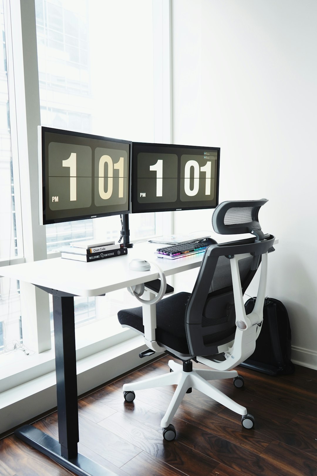 black and silver office rolling chair beside white table time tracking dashboard on laptop productivity timer running agency desk setup