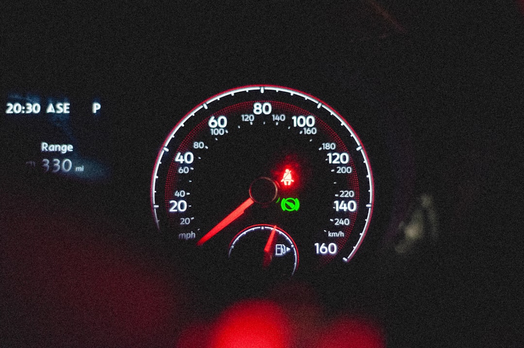 the dashboard of a car at night time database performance chart speed gauge server monitoring dashboard